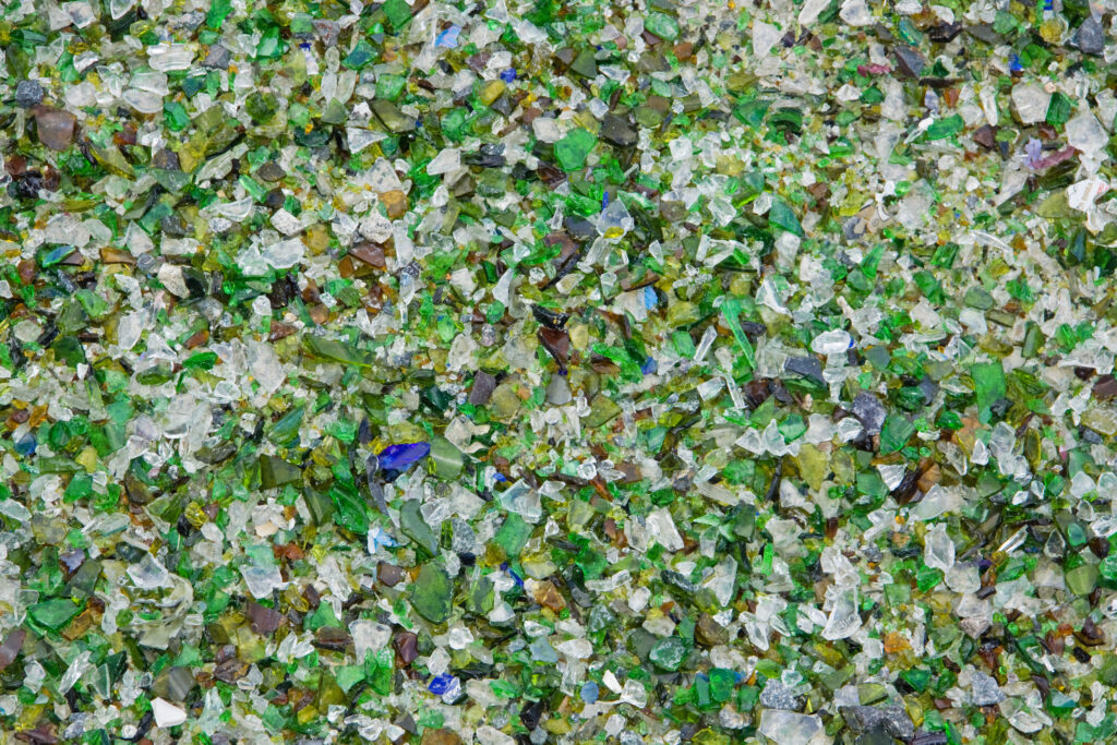 particles,of,crushed,shattered,glass,at,a,recycling,facility,in